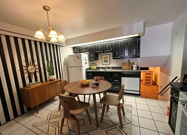 a dining room with furniture and window