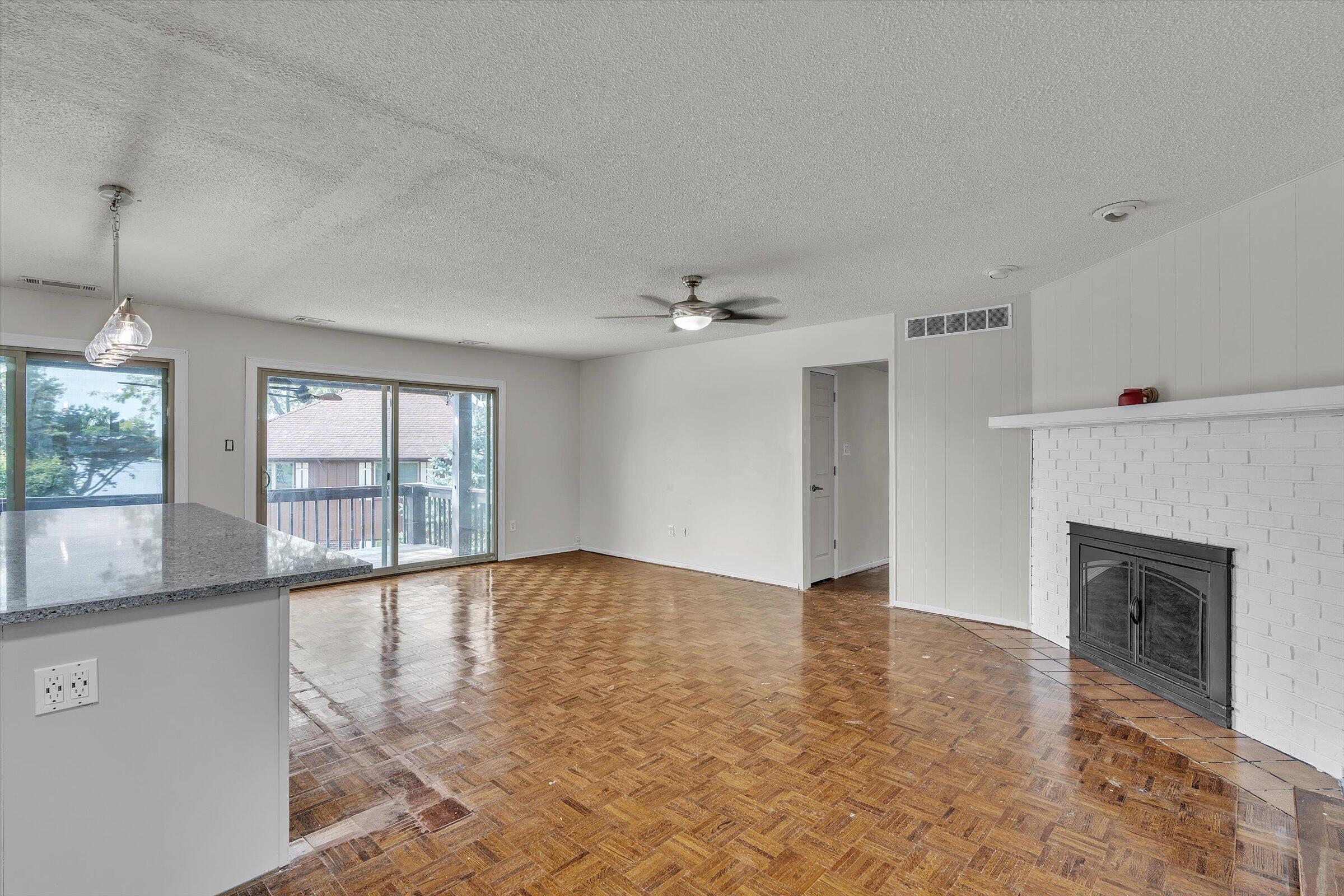 2521 East Lakeshore Drive Crown Point, IN 46307 - Photo 12 of 31 wooden floor in an empty room with a fireplace