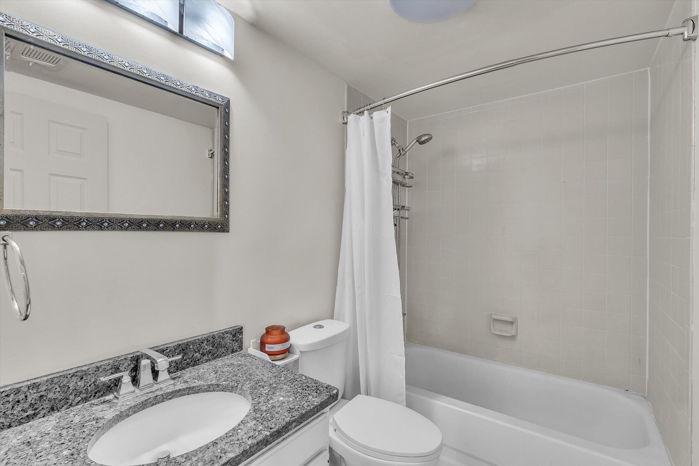 2521 East Lakeshore Drive Crown Point, IN 46307 - Photo 20 of 31 a bathroom with a granite countertop sink toilet and shower