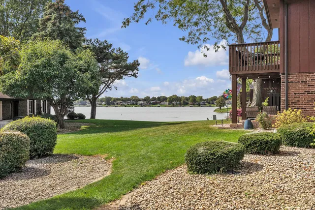 an aerial view of a house with a lake view