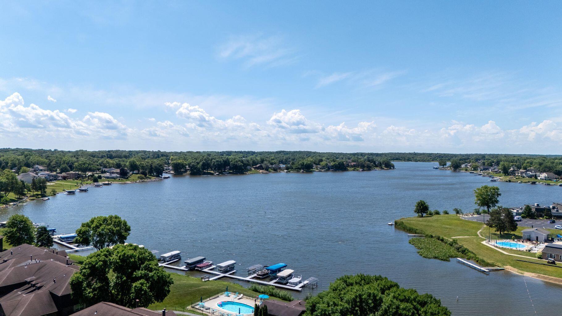 2521 East Lakeshore Drive Crown Point, IN 46307 - Photo 30 of 31 a view of a lake with houses in the back