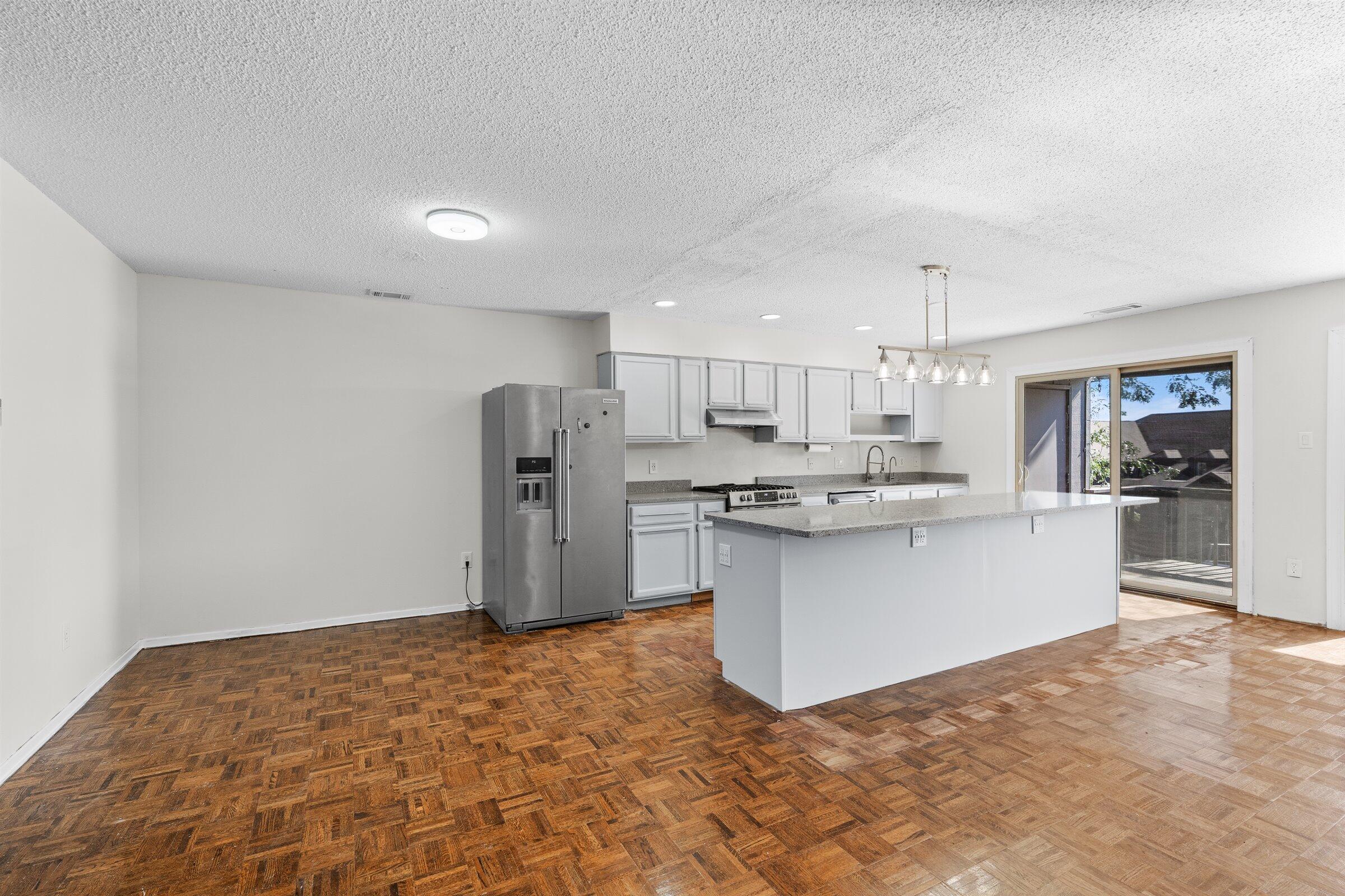 2521 East Lakeshore Drive Crown Point, IN 46307 - Photo 8 of 31 a kitchen with stainless steel appliances granite countertop a refrigerator sink and cabinets