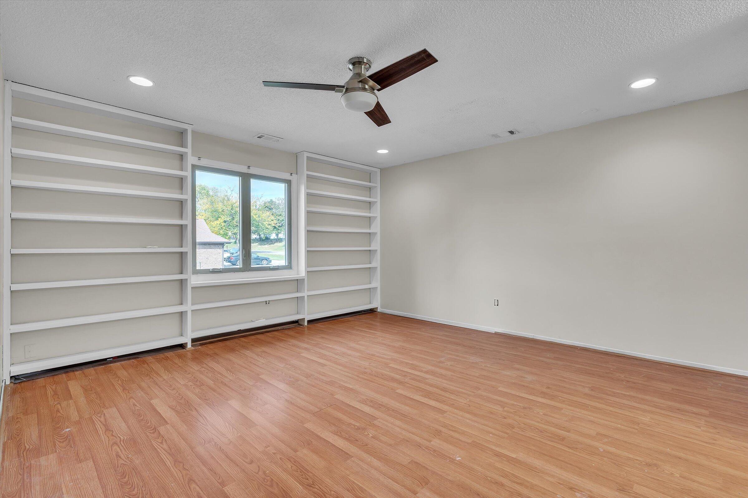2521 East Lakeshore Drive Crown Point, IN 46307 - Photo 10 of 31 wooden floor in an empty room with a window