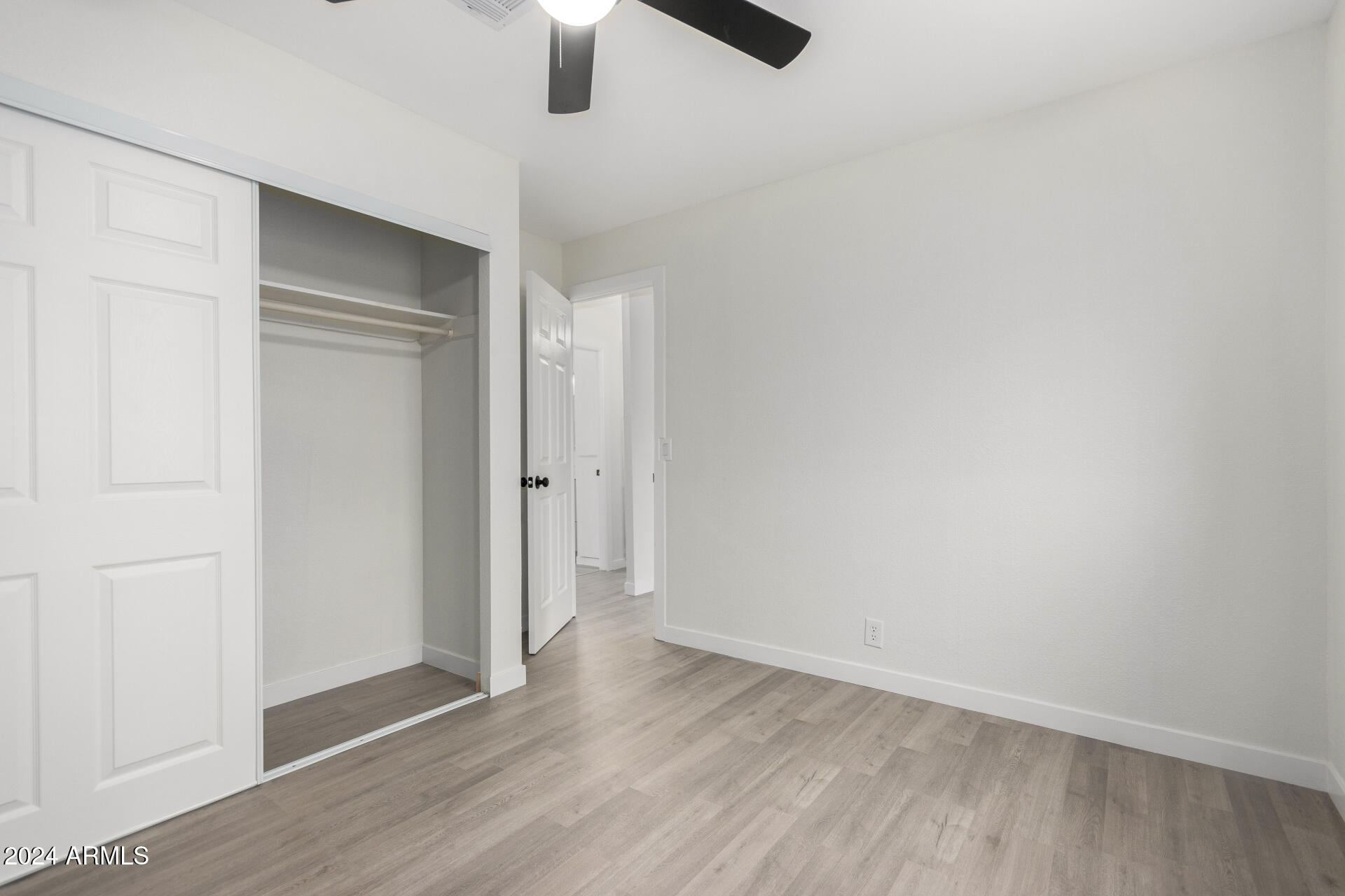 204 East Baseline Road Buckeye, AZ 85326 - Photo 15 of 29 wooden floor in an empty room