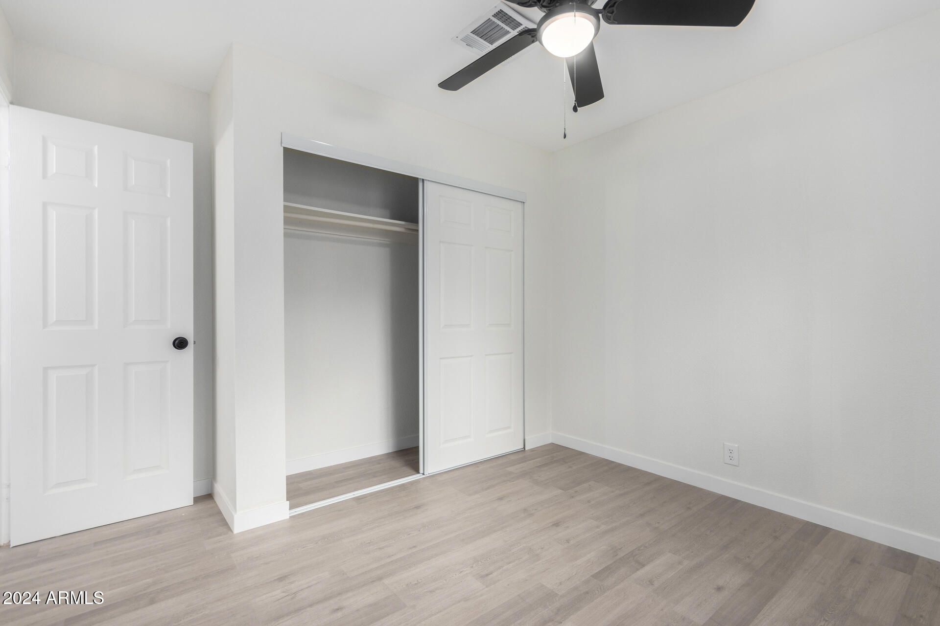204 East Baseline Road Buckeye, AZ 85326 - Photo 17 of 29 wooden floor in an empty room