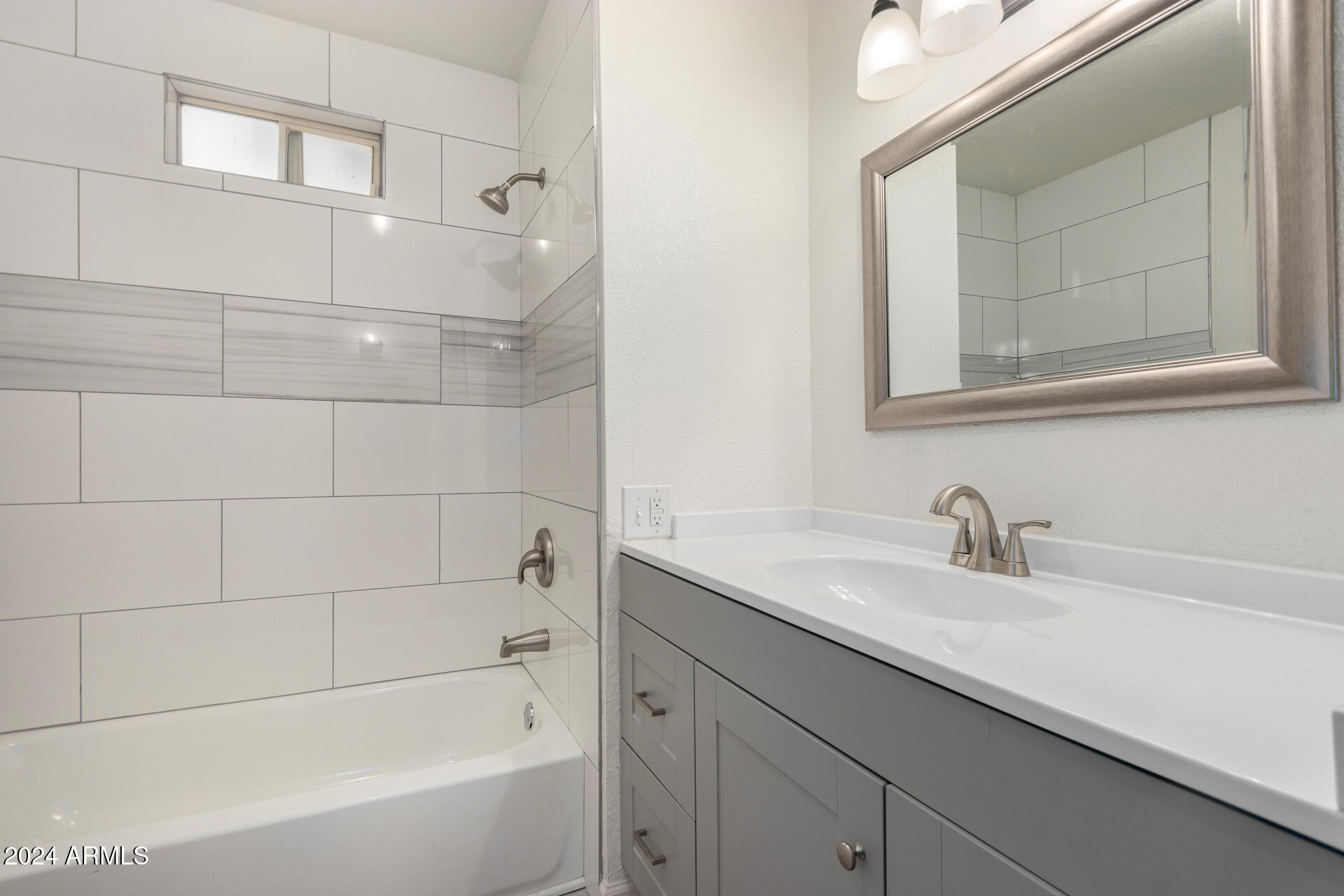 204 East Baseline Road Buckeye, AZ 85326 - Photo 20 of 29 a bathroom with a bathtub and a sink