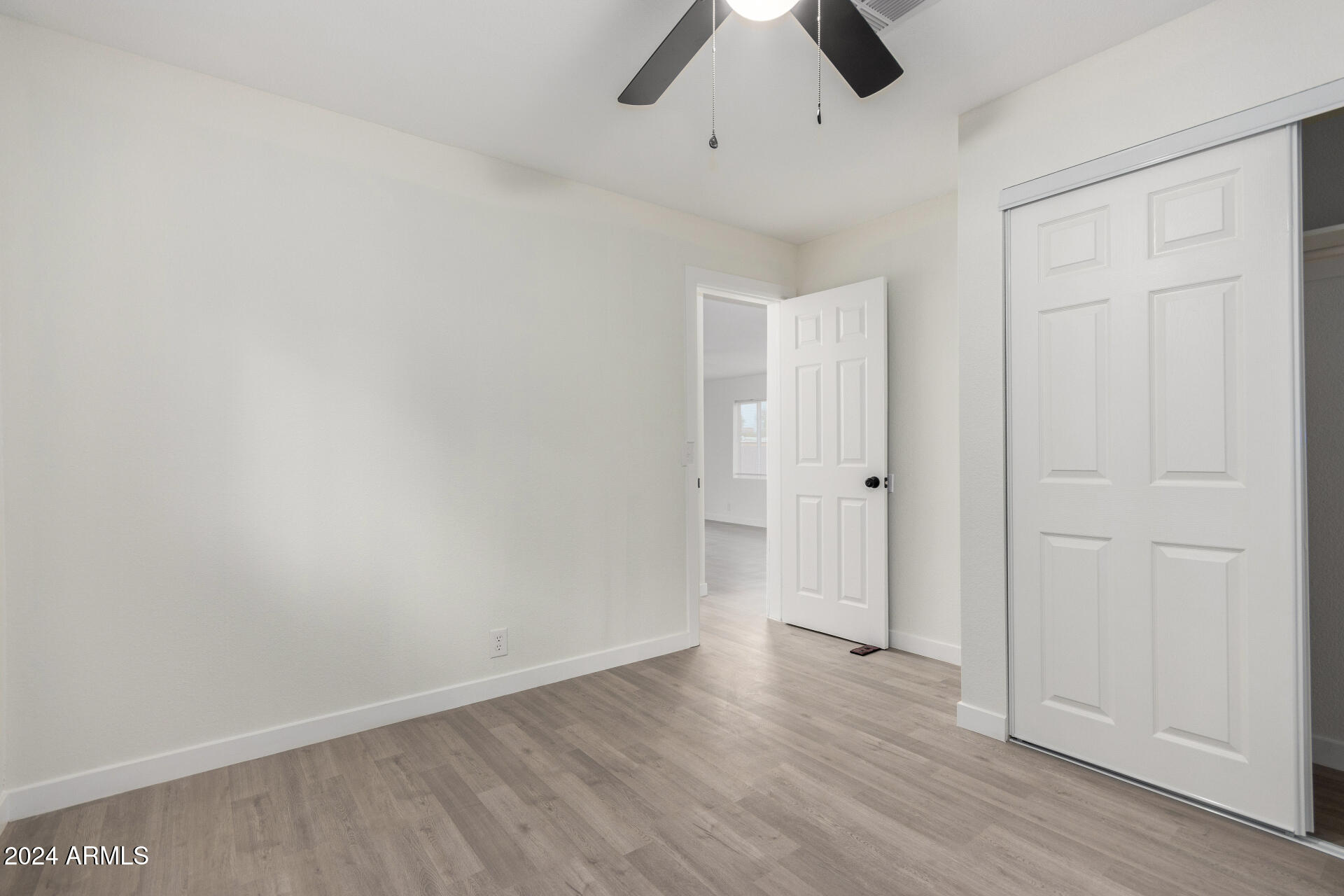 204 East Baseline Road Buckeye, AZ 85326 - Photo 22 of 29 wooden floor in an empty room