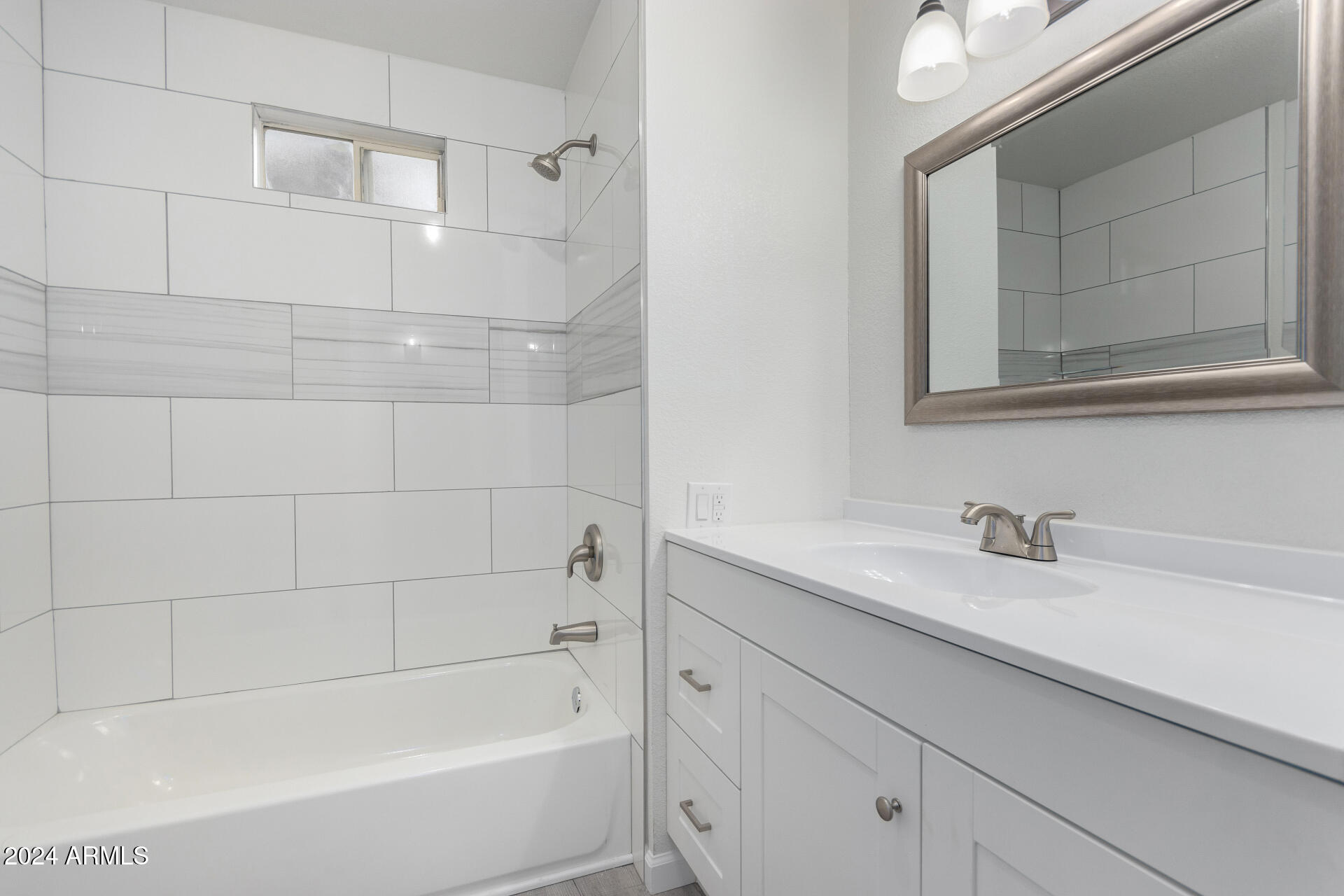 204 East Baseline Road Buckeye, AZ 85326 - Photo 23 of 29 a bathroom with a bathtub and a sink