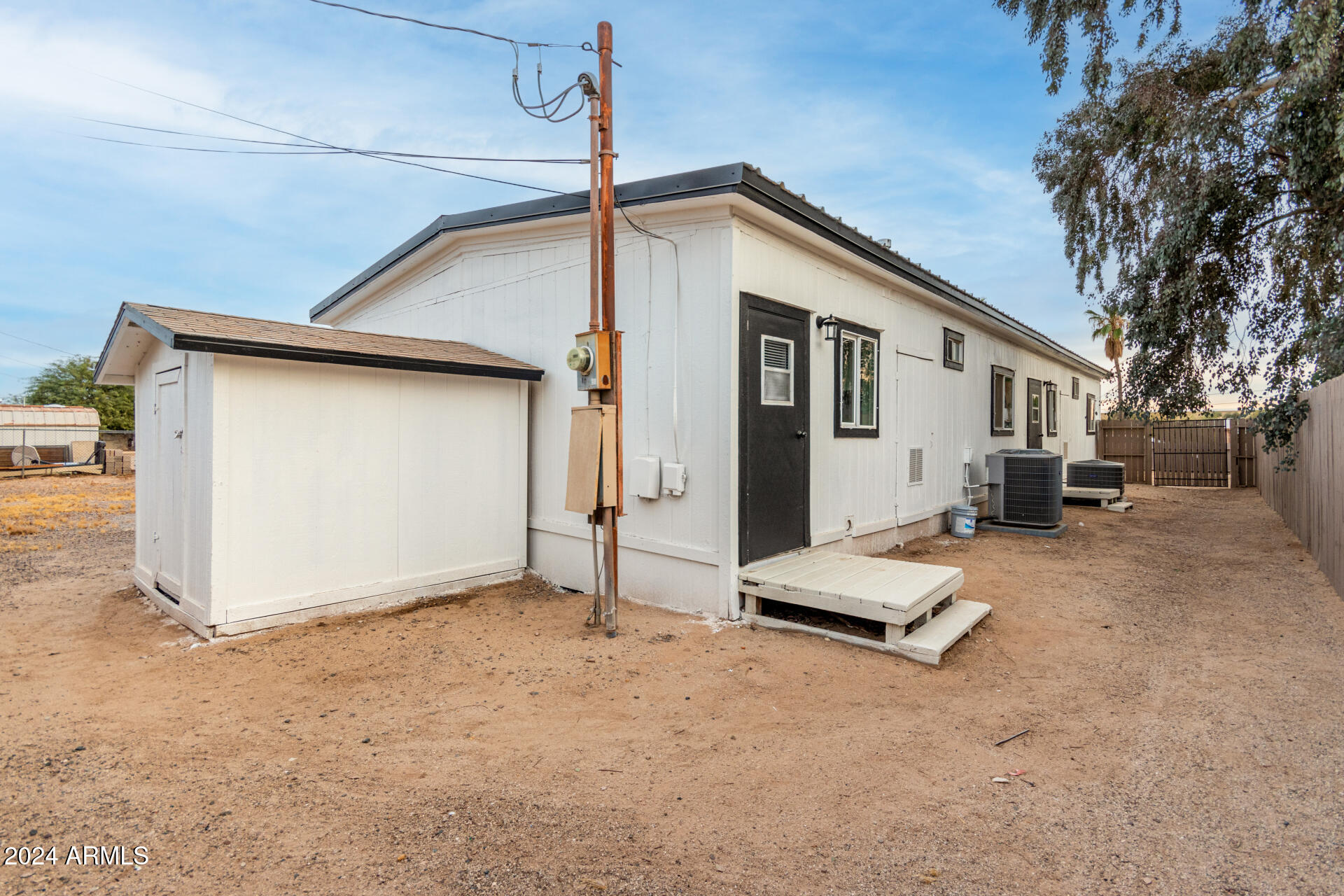 204 East Baseline Road Buckeye, AZ 85326 - Photo 24 of 29 a view of a house with backyard and garage