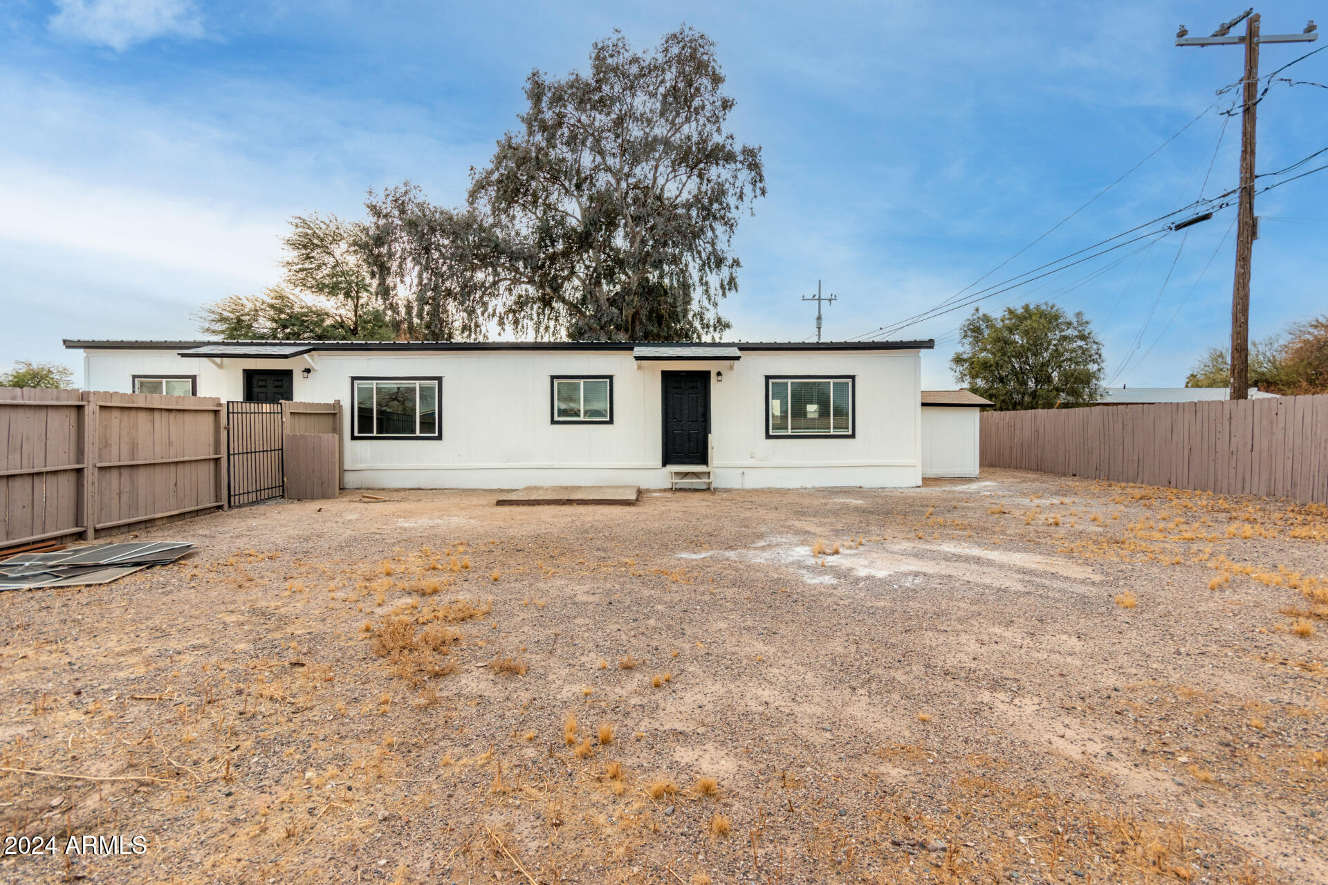 204 East Baseline Road Buckeye, AZ 85326 - Photo 26 of 29 front view of a house with a yard