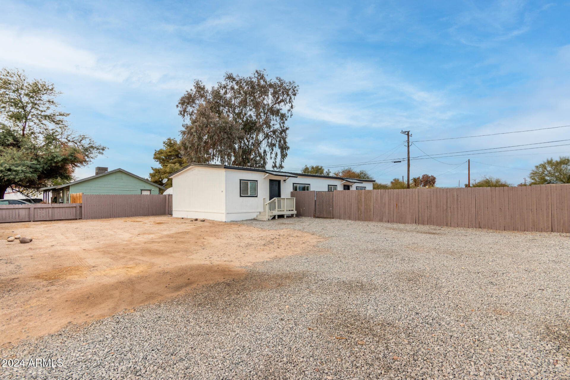 204 East Baseline Road Buckeye, AZ 85326 - Photo 29 of 29 a backyard of a house with wooden fence