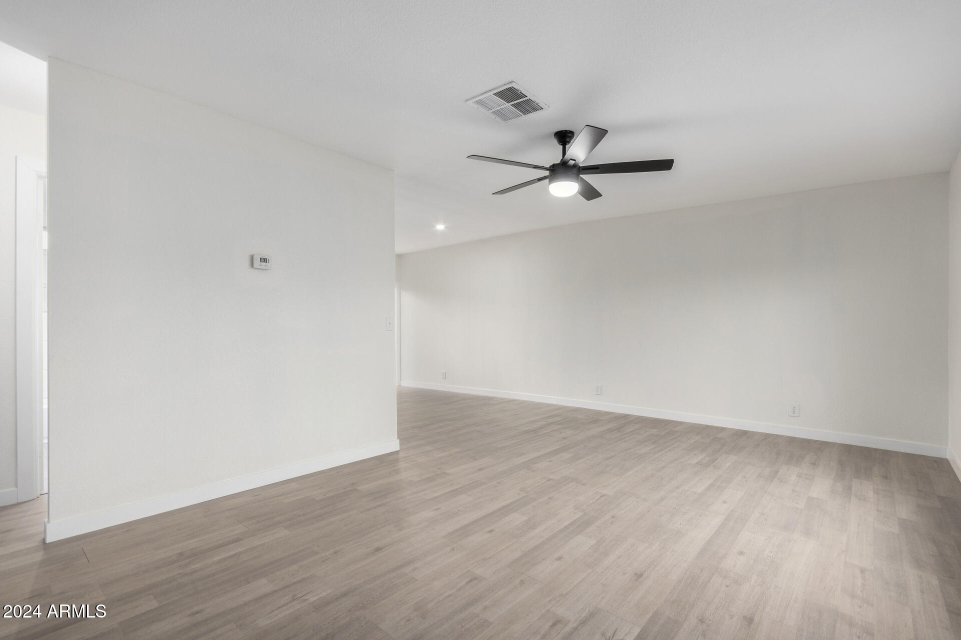 204 East Baseline Road Buckeye, AZ 85326 - Photo 5 of 29 wooden floor in an empty room