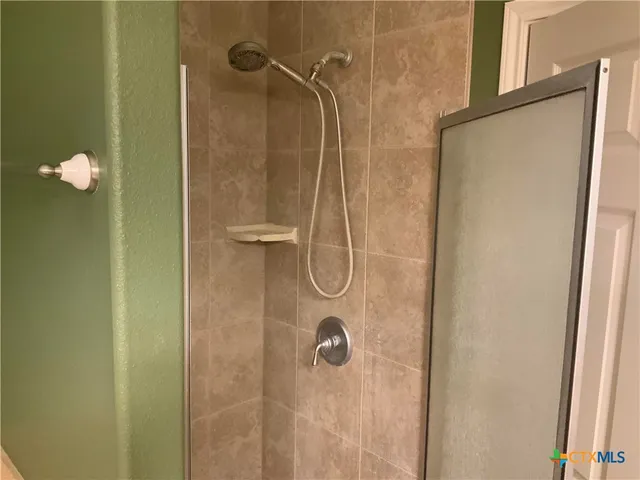 a bathroom with a sink and mirror