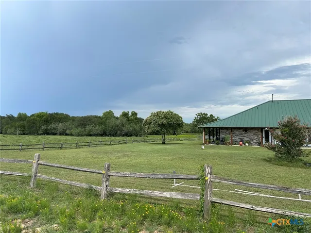a view of a park with large trees