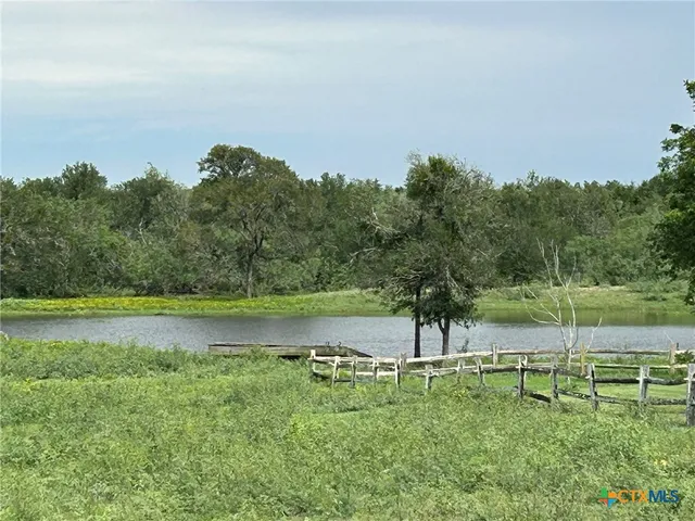 a view of outdoor space with deck and yard