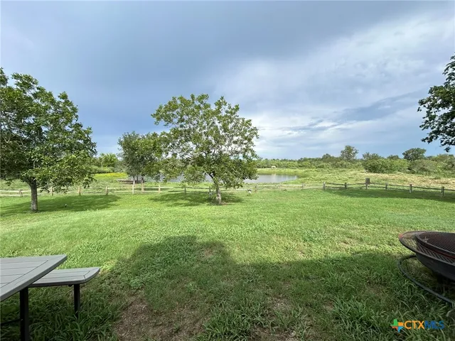 a view of a lake from a yard