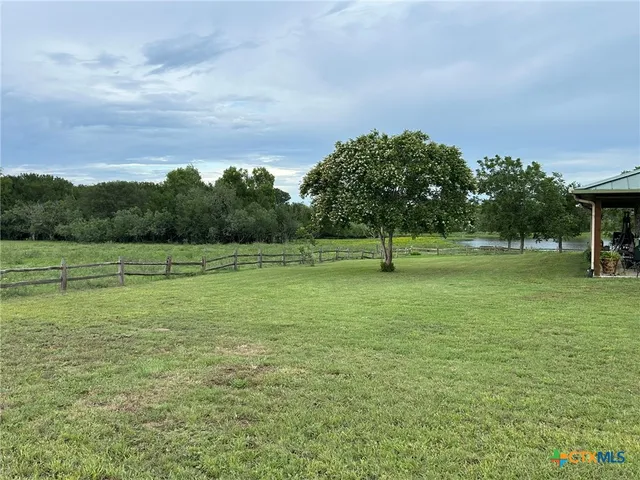 a view of ocean with a barbeque