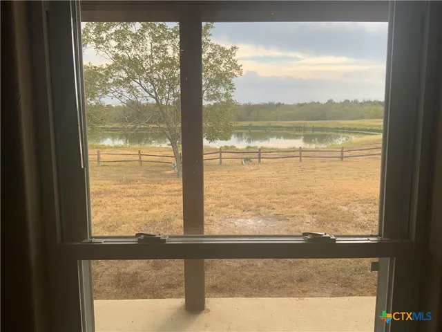 a kitchen with a refrigerator sink and cabinets