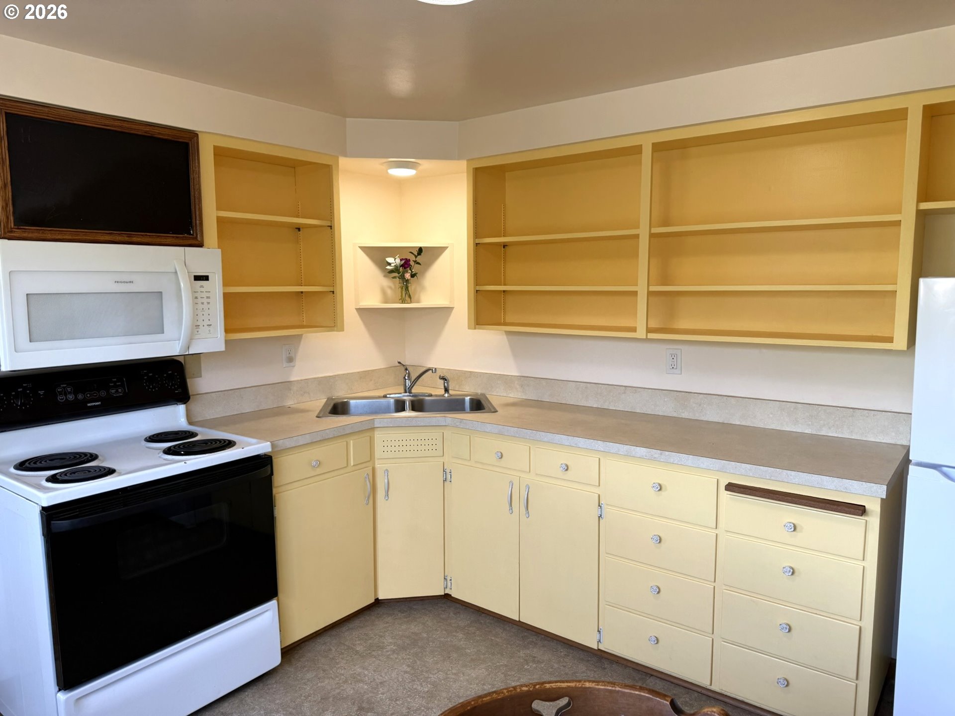 1179 6th Street Florence, OR 97439 - Photo 15 of 26 a kitchen with a sink and a stove top oven