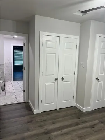 a bathroom with a sink vanity mirror and toilet