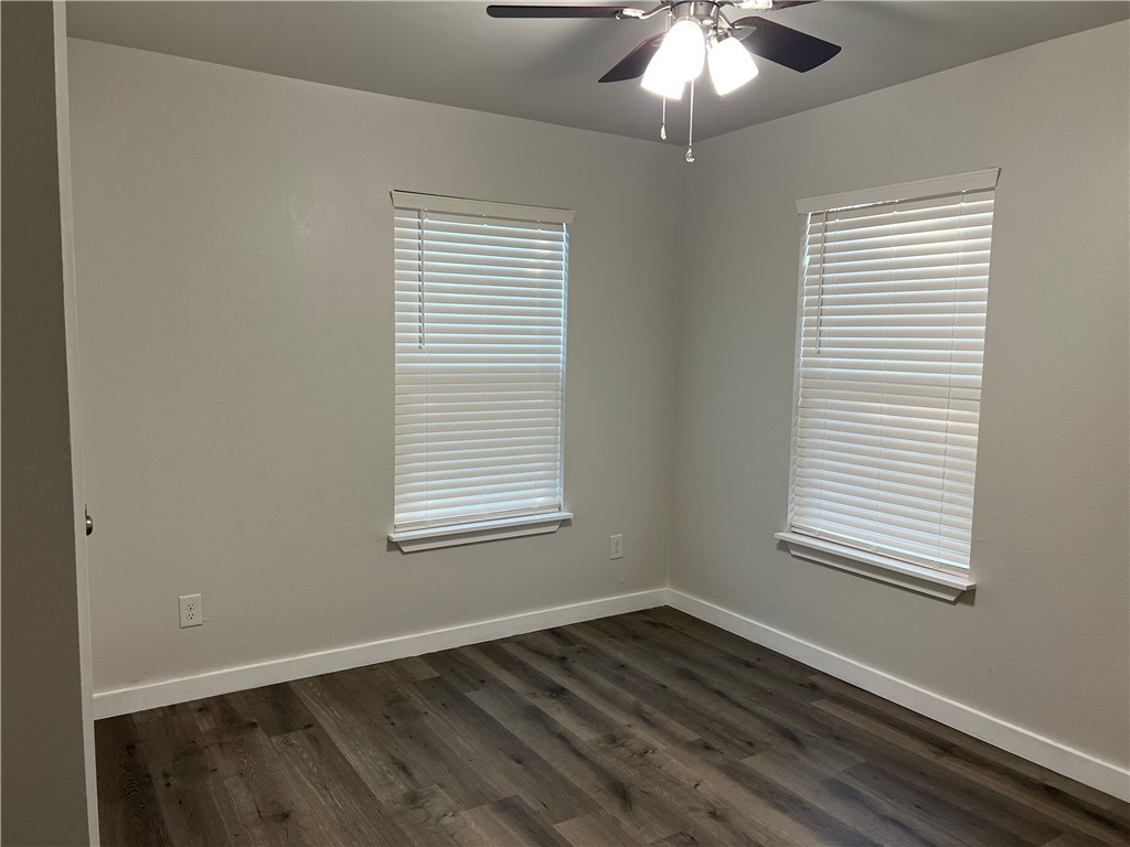 912 North Rife Street Aransas Pass, TX 78336 - Photo 21 of 23 a view of an empty room with window and chandelier fan