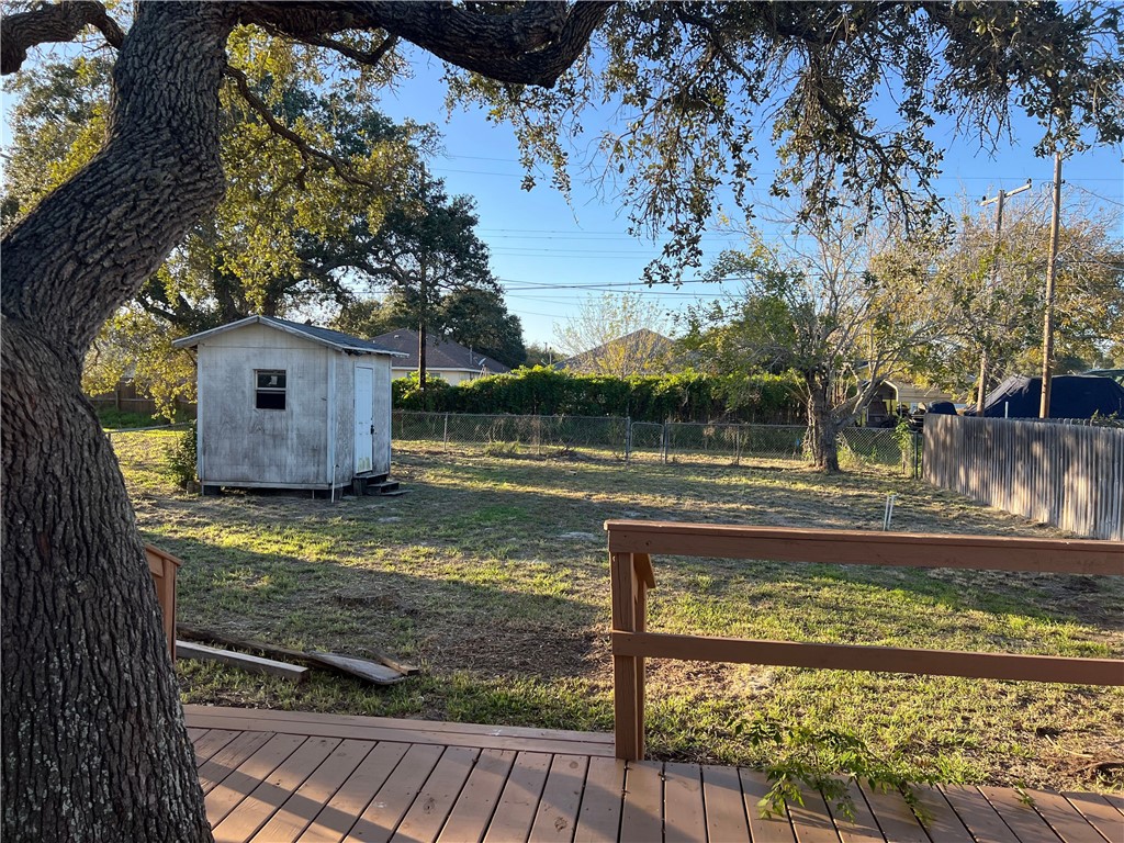 912 North Rife Street Aransas Pass, TX 78336 - Photo 23 of 23 a view of a yard with wooden fence