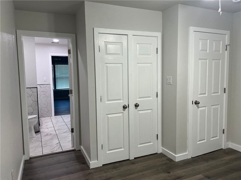 912 North Rife Street Aransas Pass, TX 78336 - Photo 10 of 23 an empty room with wooden floor and closet