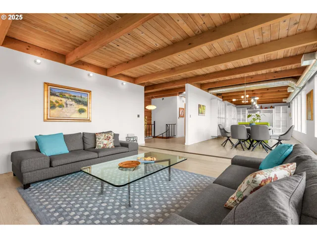 a living room with furniture and a table