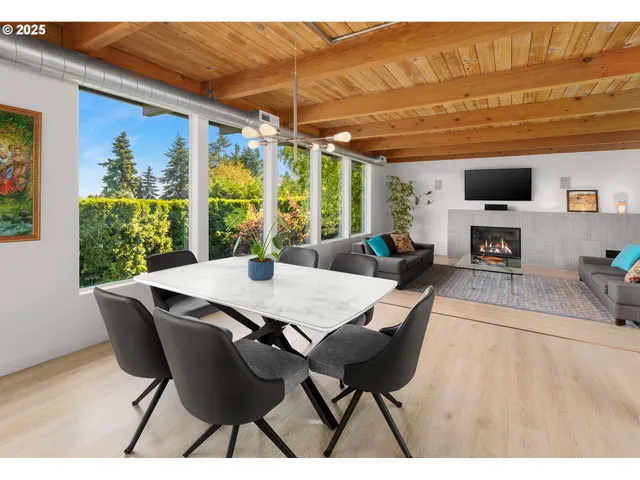 a view of a dining room with furniture window and outside view