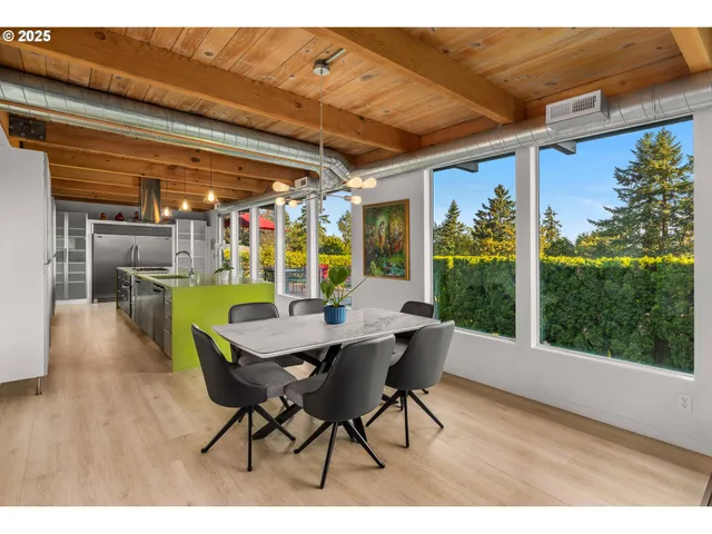 a dining room with furniture and wooden floor