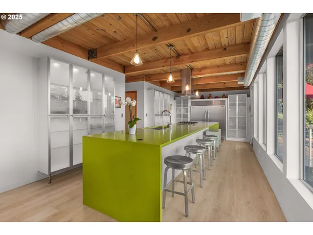 a view of a room with wooden floor