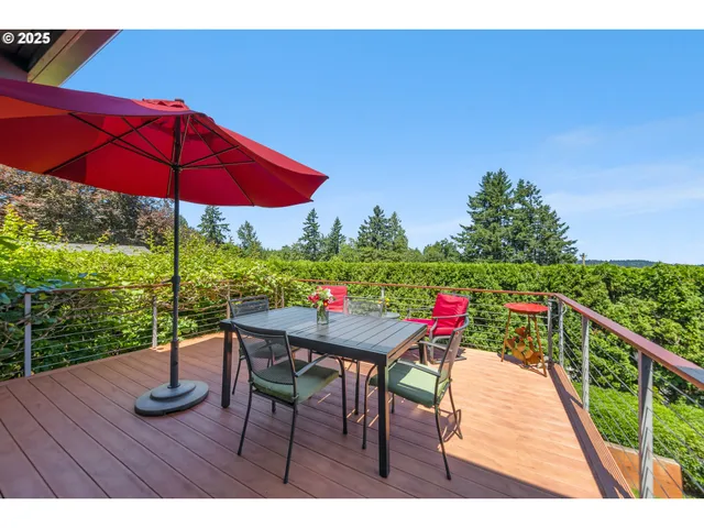 a view of a deck with furniture and yard