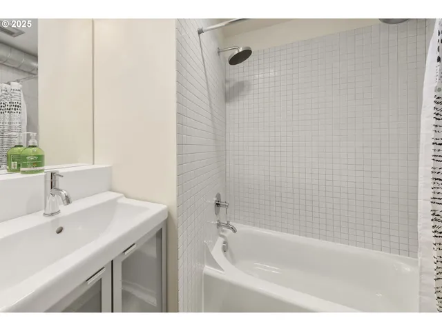 a bathroom with a sink and a bathtub
