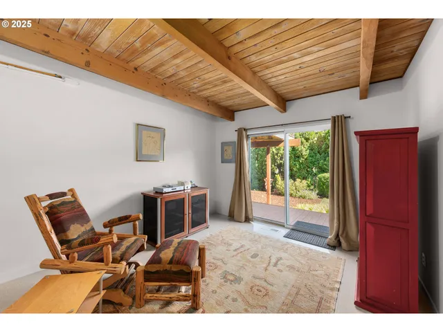 a bedroom with furniture and a window