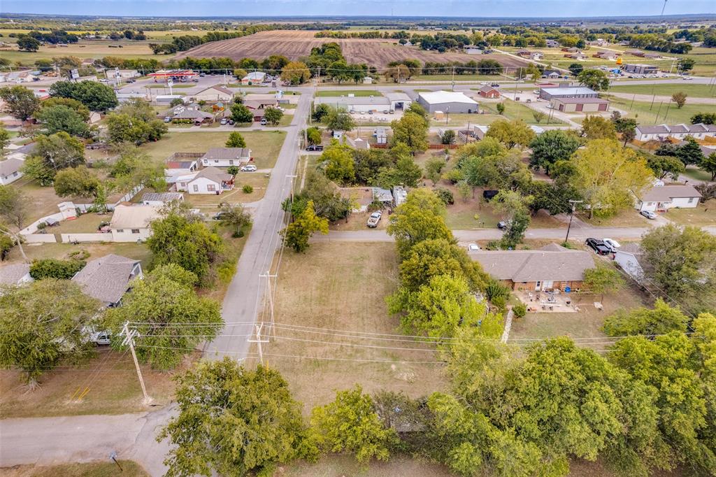 511 East Houston Street Leonard, TX 75452 - Photo 2 of 5 an aerial view of residential houses with outdoor space