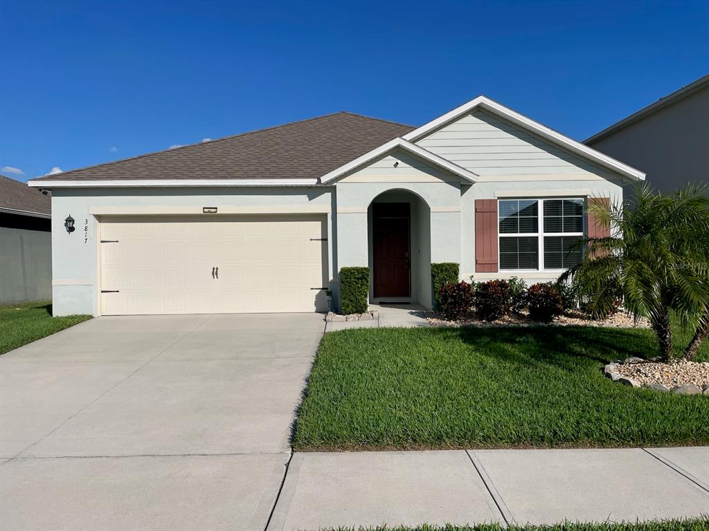 3817 Heartleaf Lane Mount Dora, FL 32757 - Photo 1 of 1 a view of a house with a yard