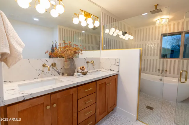 a bathroom with a sink double vanity and a mirror
