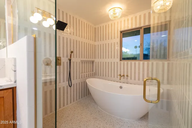 a bathroom with a bathtub and shower