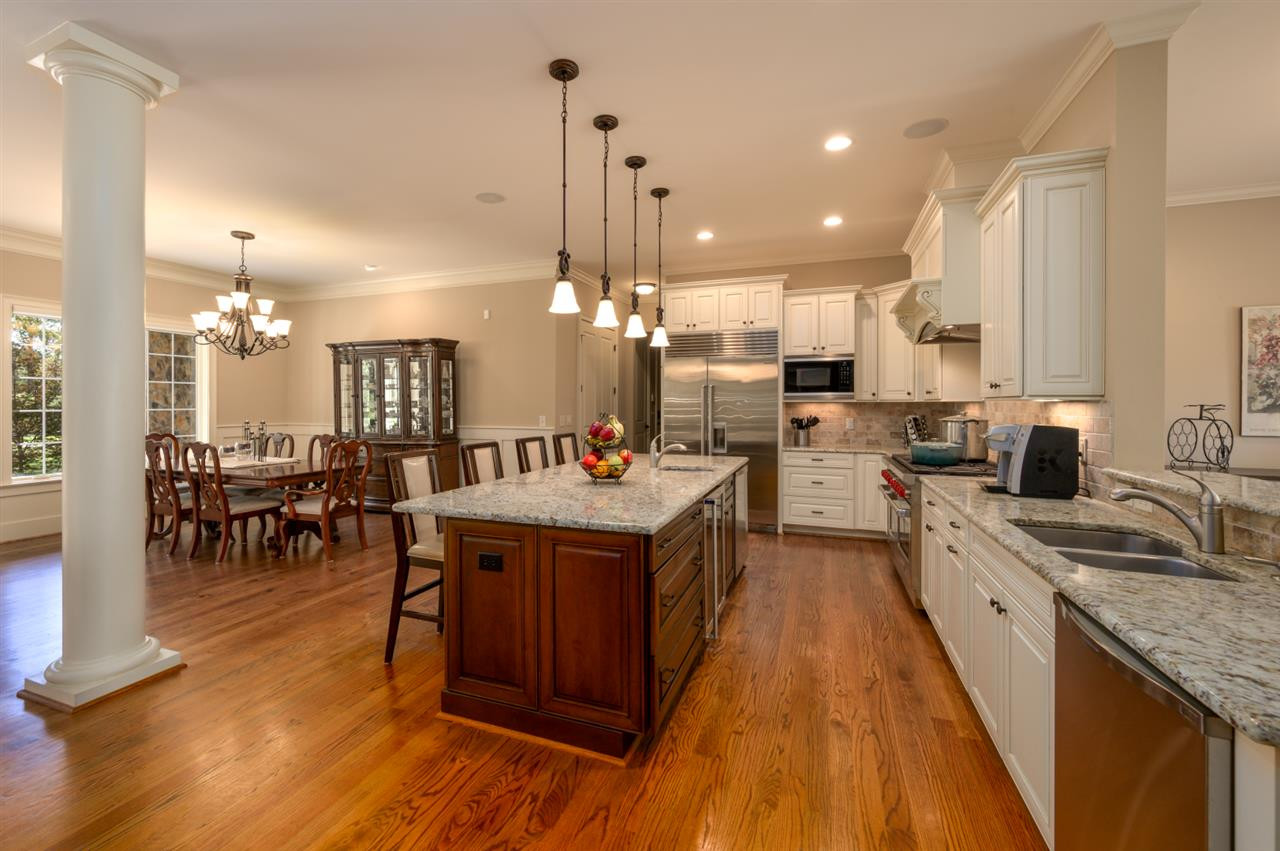 2124 Old Sorrell Road Apex, NC 27539 - Photo 5 of 30 This Kitchen has everything! Subzero refrigerator. granite, beautiful cabinetry, 2 dishwashers, wine cooler, Wolf 8 burner gas range, Wolf microwave, prep sink, under cabinet lighting, pantry & large center island. Gourmet Kitchen