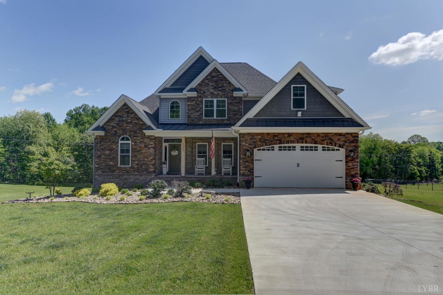 2667 Bellevue Road Forest, VA 24551 - Photo 1 of 55 a front view of a house with a yard and garage