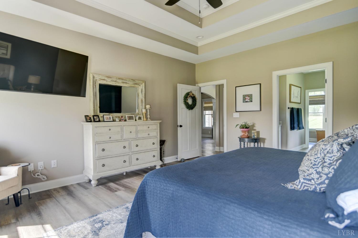2667 Bellevue Road Forest, VA 24551 - Photo 14 of 55 a bedroom with a bed and a flat screen tv