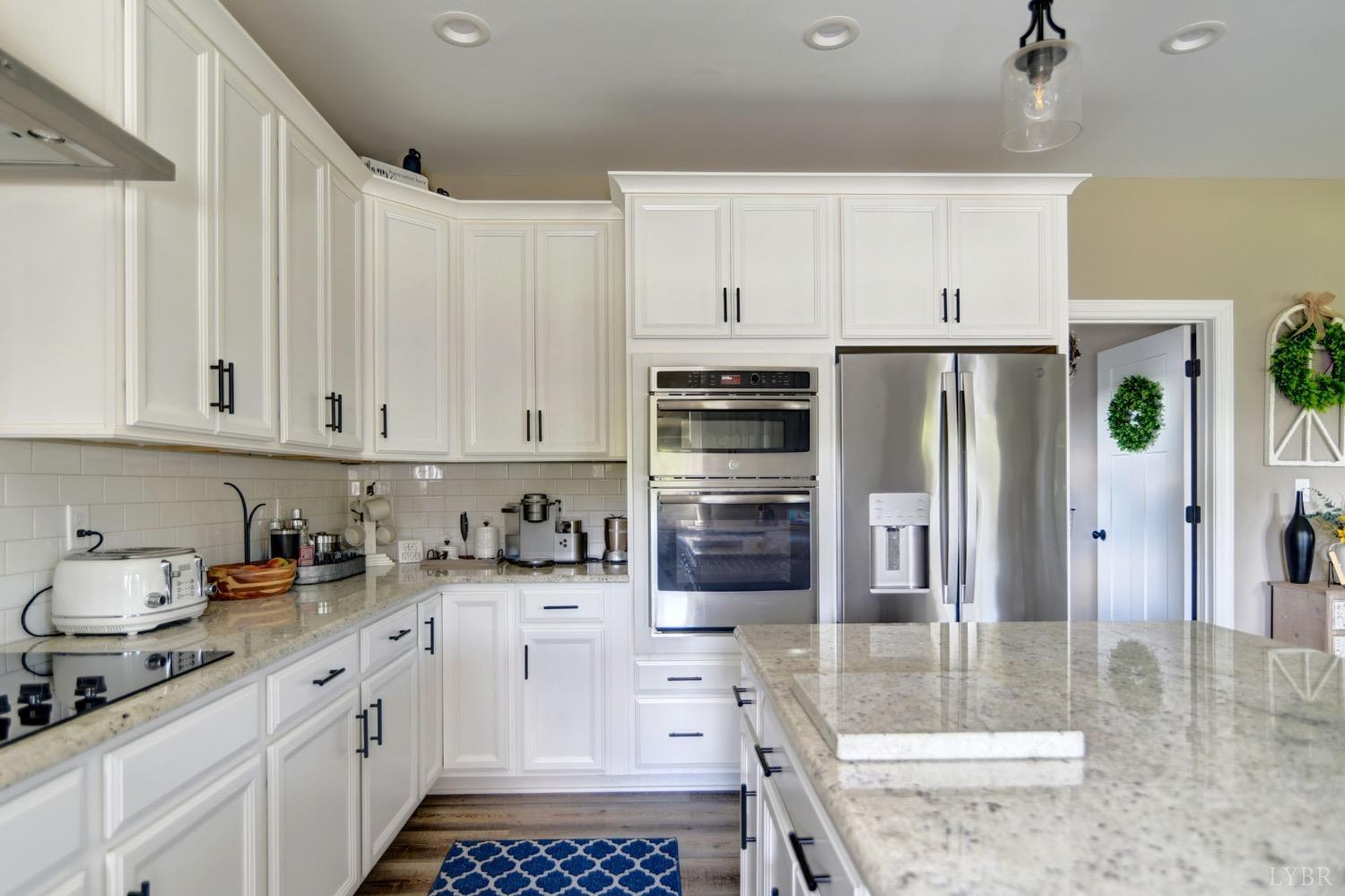 2667 Bellevue Road Forest, VA 24551 - Photo 21 of 55 a kitchen with stainless steel appliances a refrigerator sink and cabinets