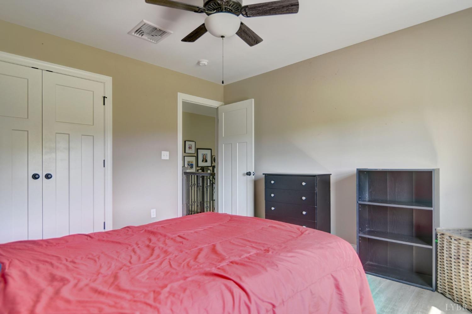 2667 Bellevue Road Forest, VA 24551 - Photo 33 of 55 a bedroom with a bed and a walk in closet