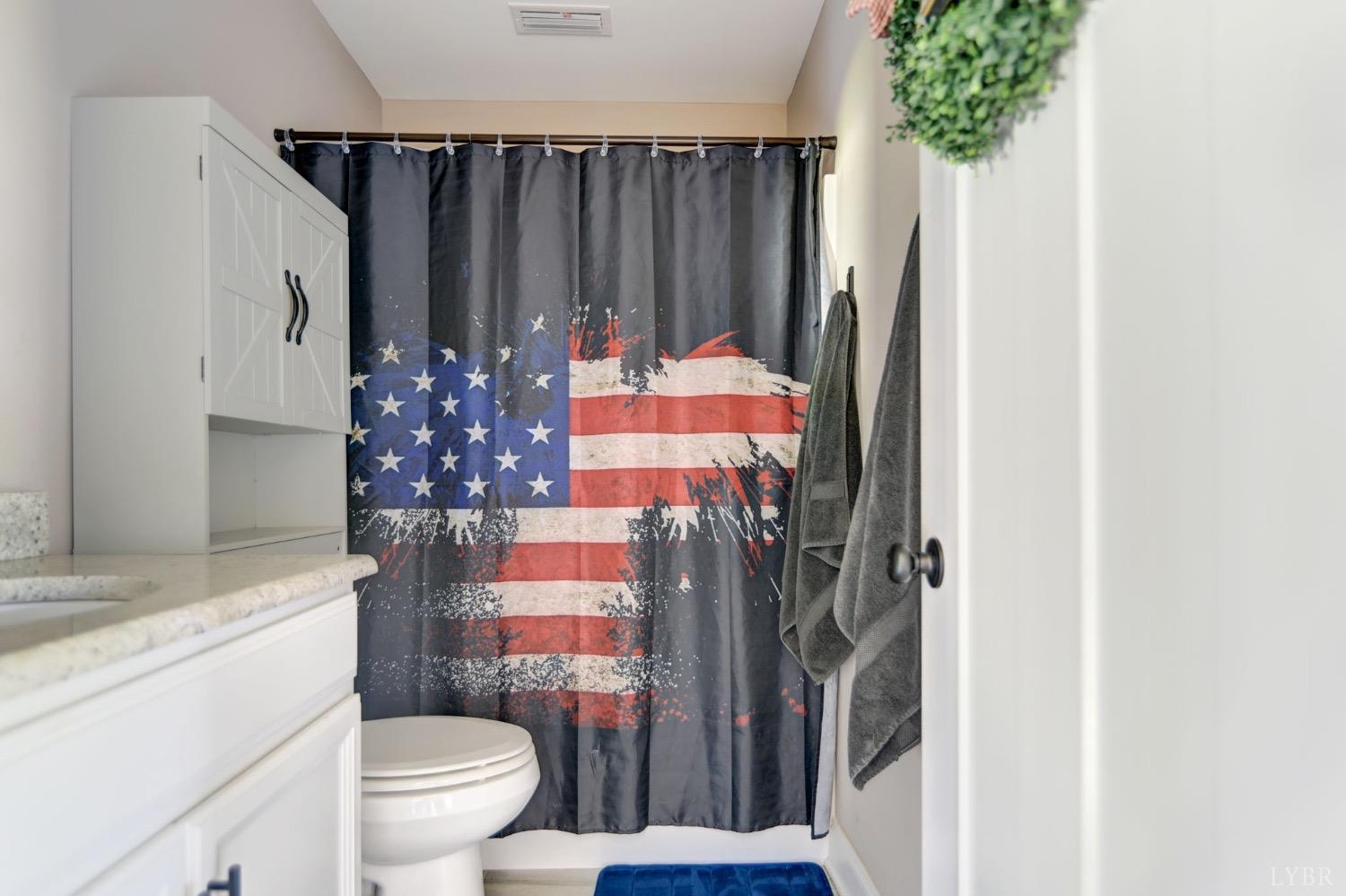 2667 Bellevue Road Forest, VA 24551 - Photo 34 of 55 a bathroom with a toilet and a shower curtain