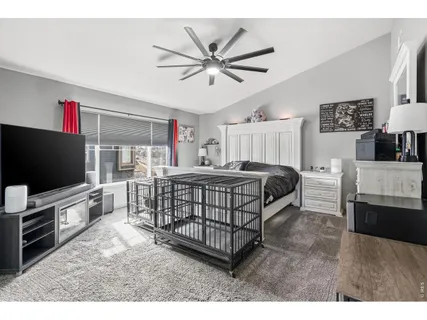 a bedroom with furniture and window