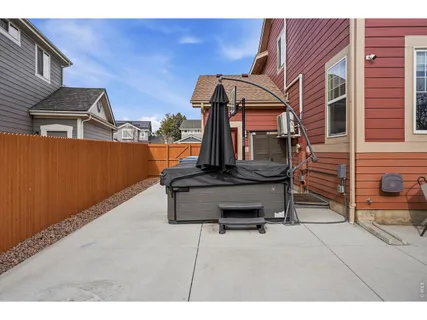 a front view of a house with patio and garden