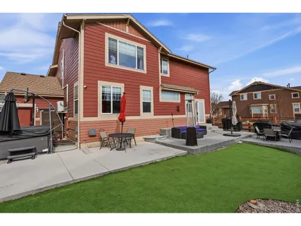 a front view of a house with a garden and sitting area