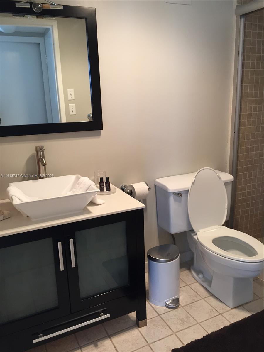 Surfside Surfside, FL 33154 - Photo 11 of 27 a bathroom with a toilet sink and mirror