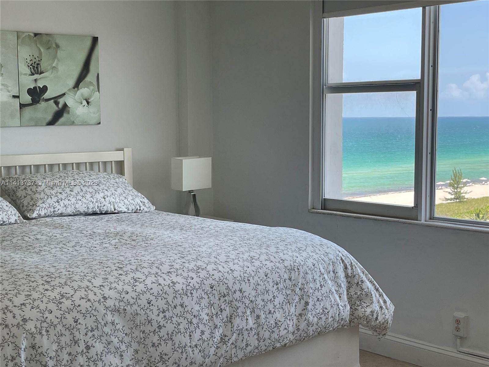 Surfside Surfside, FL 33154 - Photo 13 of 27 a bedroom with a bed and a window