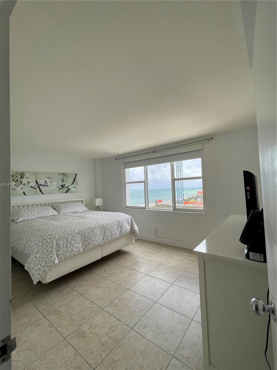 Surfside Surfside, FL 33154 - Photo 2 of 27 a bedroom with a bed and a window